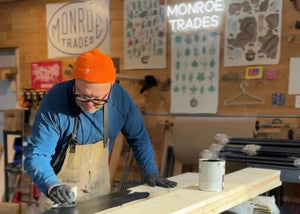 Patrick staining wood for his distressed clothing stand and rack platforms