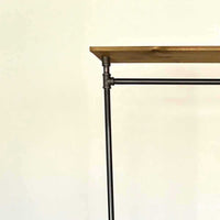 Monroe Trades mobile clothing rack closeup of top wood shelf and industrial pipe fittings