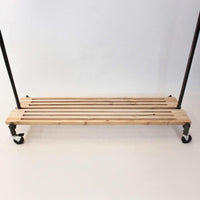 Monroe trades rolling clothing rack with cedar bottom rack for boots and storage