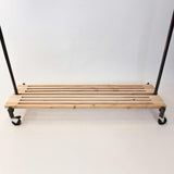 Monroe trades rolling clothing rack with cedar bottom rack for boots and storage