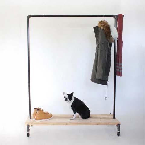 Monroe Trades rolling clothing rack with a dog and clothes stored tin the rack and bottom shelf