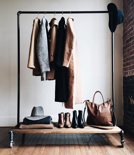 Clothing rack with distressed wood platforms