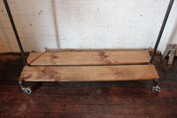 Clothing rack with distressed wood platforms