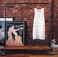 Clothing rack with distressed wood platforms